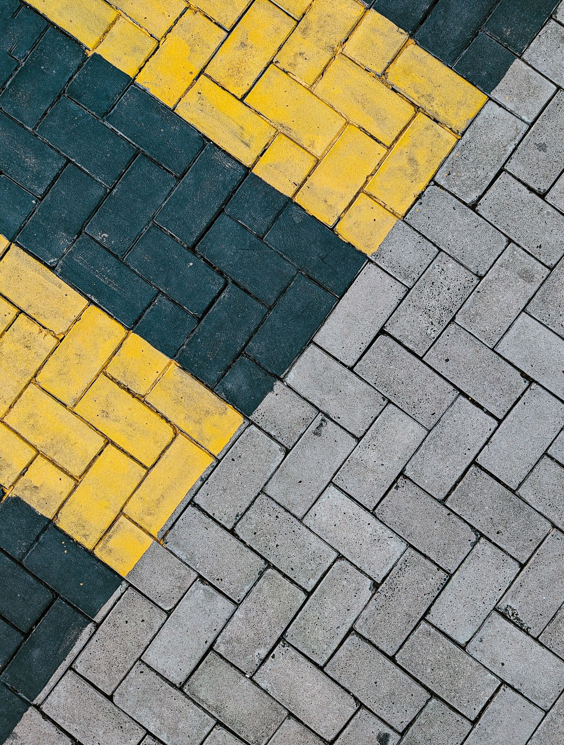 Vibrant black and yellow patterned sidewalk in New Town, India, showcasing urban design.
