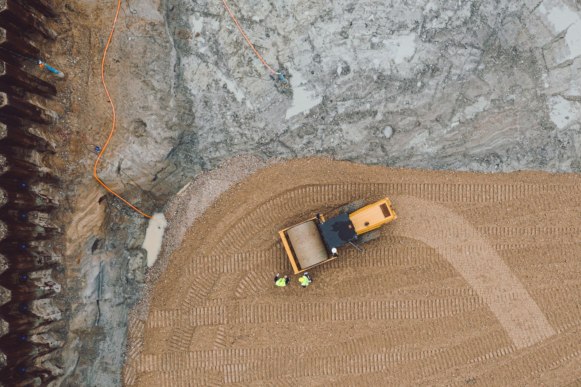 an aerial view of a tractor in a field